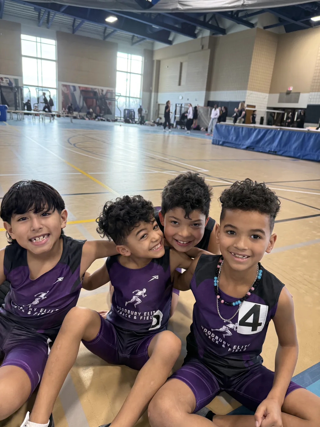 Woodbury Elite athletes together at an indoor meet