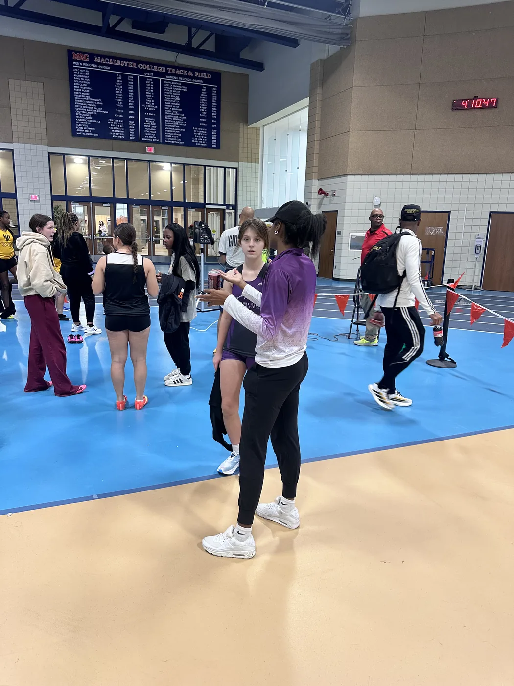 Coach providing individual guidance to a Woodbury Elite athlete